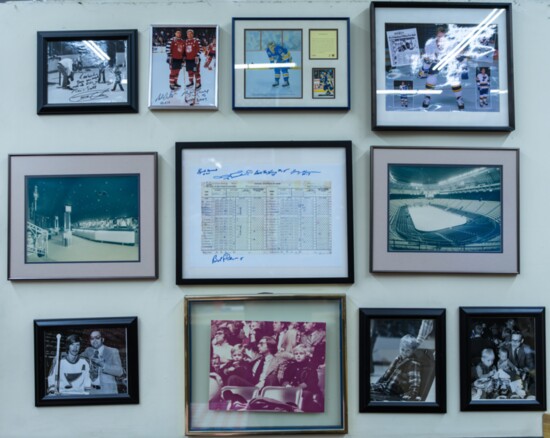 Sports memorabilia wall covers the wall at Combs