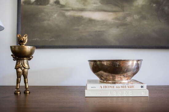 Styling everyday surfaces with sculptural accents and layered textures adds instant depth.