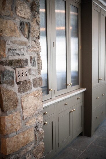 Pairing original stonework with custom cabinetry brings old and new together seamlessly, where function meets heritage in the most beautiful way.