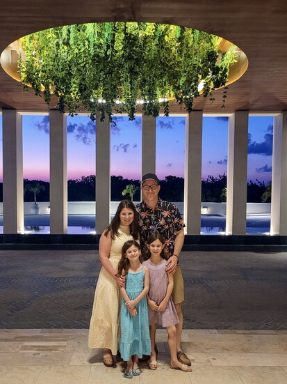 Tyler with his wife and two twin daughters on a recent trip. 