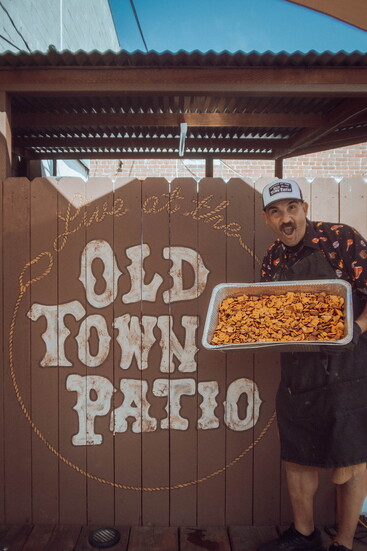 Fresh from the kitchen, Uncle Chico shows off his signature Smoked Chex Mix.