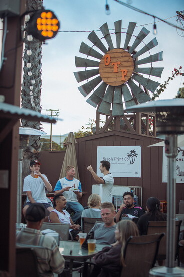 Guests savor BBQ bites and refreshing drinks on Old Town Patio’s iconic outdoor patio.