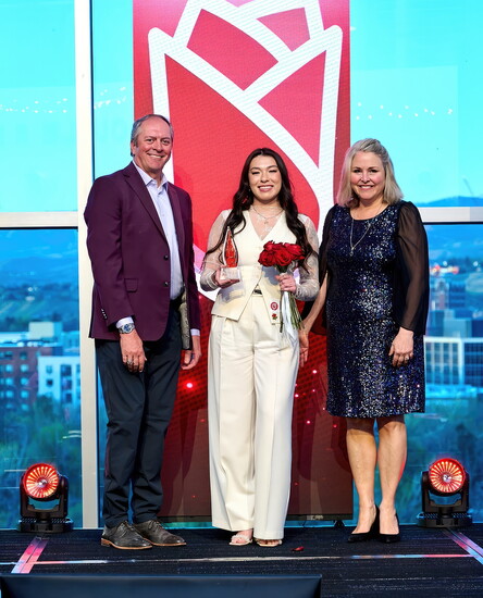 Amy Frump of Inn at 500 accepts the Leadership & Learning Excellence Award alongside Carrie Hughes of Visit Boise and Hart Gilchrist of Intermountain Gas