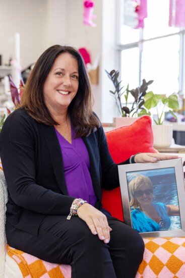 Caroline McKinney, Liberty Township Administrator, displays a photo of her mom Debra Garmhausen, who lives in West Chester but was in Florida on picture day.