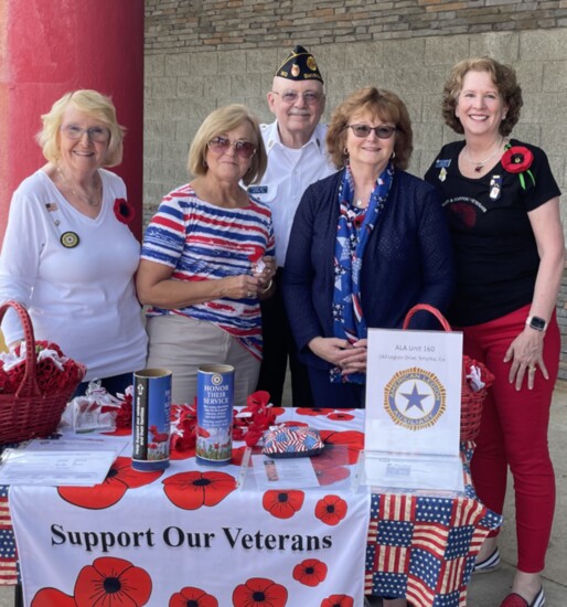 American Legion AuxiliarySmyrna Unit 160 Members distribute poppies in support of veterans.