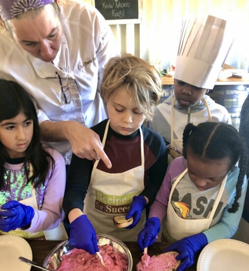 Kids cooking the harvest with Recipe for Success. Photo courtesy of Hope Farms