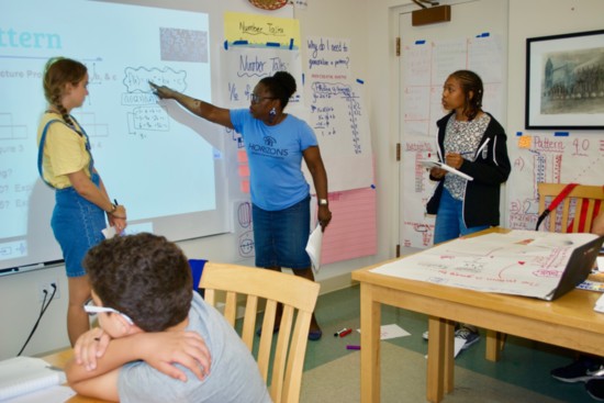 Math Teacher Rose Okai teaching HGFA students, assisted by Classroom Intern Darcy Whitman, GFA '18.