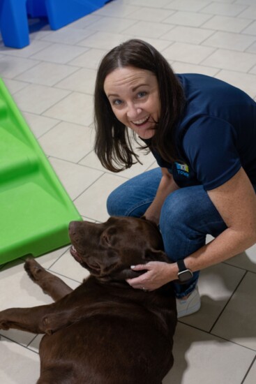 Jessica McNaughton and a happy Hounds Town of West Denver-Arvada visitor.