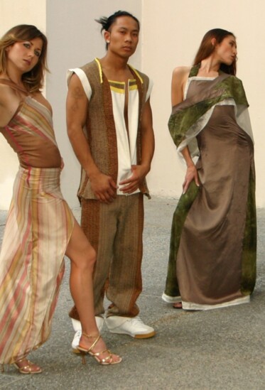 House of eMaGi’s asymmetric bodycon dress, 2-piece made from woven upholstery textiles with a linen chest plate, and silk and chiffon evening gown with a shawl.