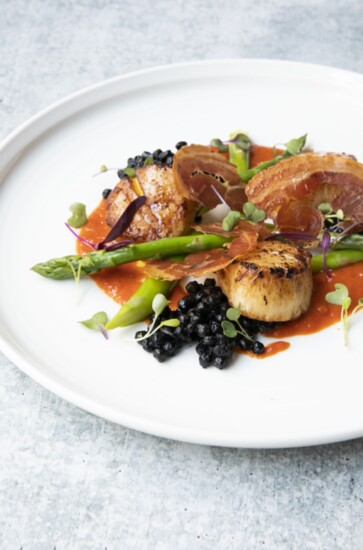 Seared Scallops with squid ink foretold. Photo courtesy of Warehouse 72. 