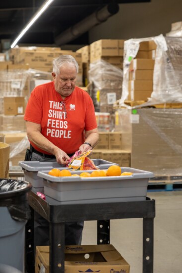 Inside, volunteers gather the client's food selections.