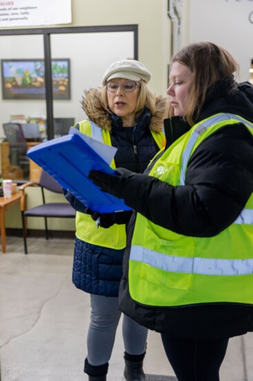 Volunteers collaborate to best support the pantry's clients.