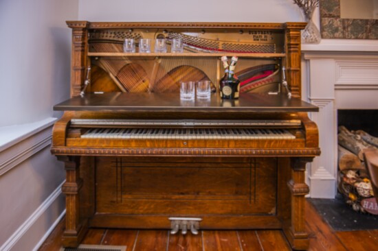 Converted piano into bar...bar was gift from former boss wishing Dominique good luck with her New Hope Boutique.