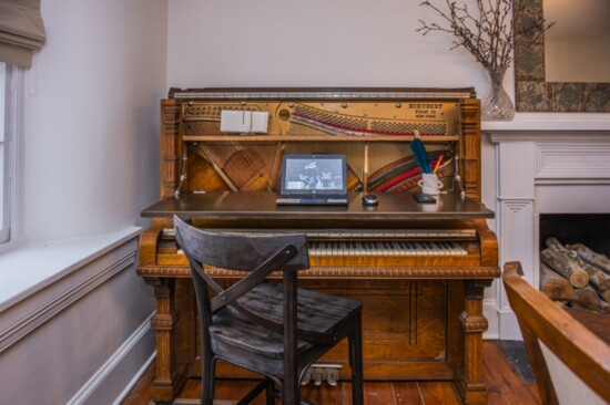 Converted piano shown as a desk station.