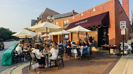 Norton’s bustling outdoor patio remains a favorite gathering place in the heart of Highland Park. (Photo by Cat Rolfes)