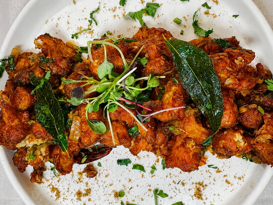 Crispy spiced cauliflower at Madurai showcases the bold South Indian flavors the restaurant is known for. (Photo by Cat Rolfes)