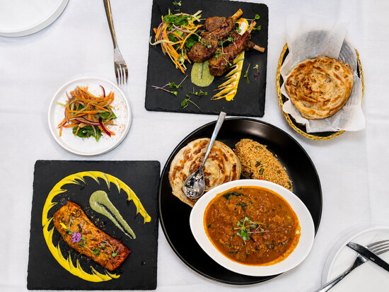 A vibrant spread at Madurai Kitchen in Glenview, reflecting the South Indian flavors shaped by founders Ravishankar and Srirangarajan. (Photo by Cat Rolfes)