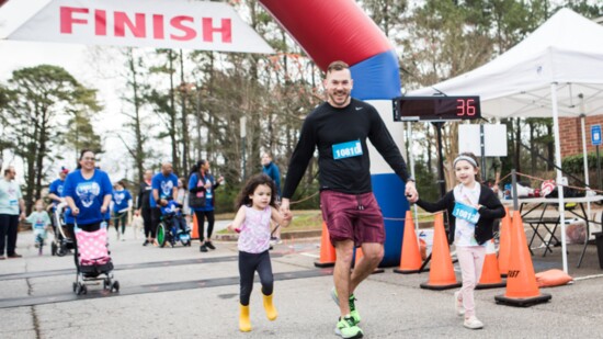 Runners reach the finish line at Hustle for Hope. 