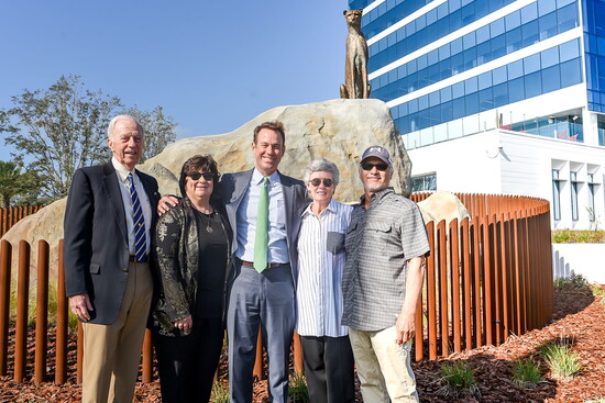 The unveiling of the cheetah statue with Hyatt, Linda Downs, Powell, Cici, and local artist Paul Baliker. (Photo Credit: Brown & Brown)