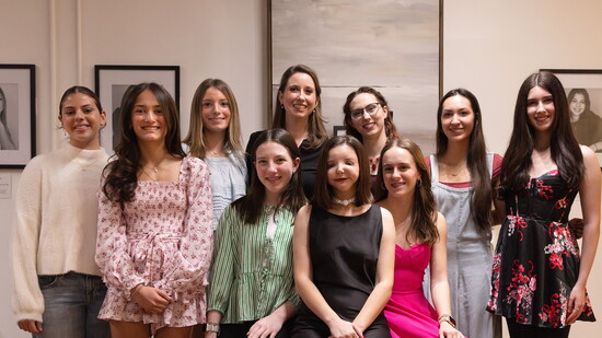 Ashley Hugghins & some of the young women who helped bring I Am More Than to life.