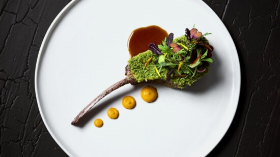 Seared lamb chop brushed with Dijon topped with panko crumbs mixed with pistachios and local arugula, meant to mimic the forest floor in spring.