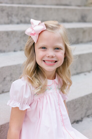 A sweet smile and timeless style make every moment picture-perfect.