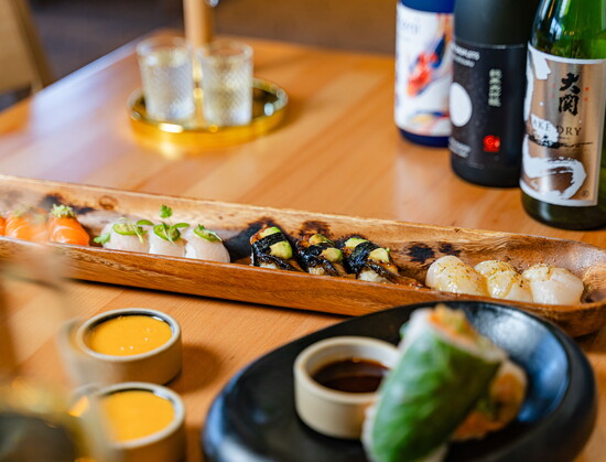 "The wooden backdrop allows each nigiri piece’s vibrant colors to stand out while creating a dramatic moment when it arrives table-side due to its size."
