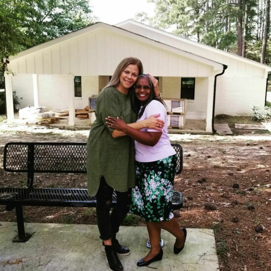 Jennifer and Jacque in front of the cottage during construction