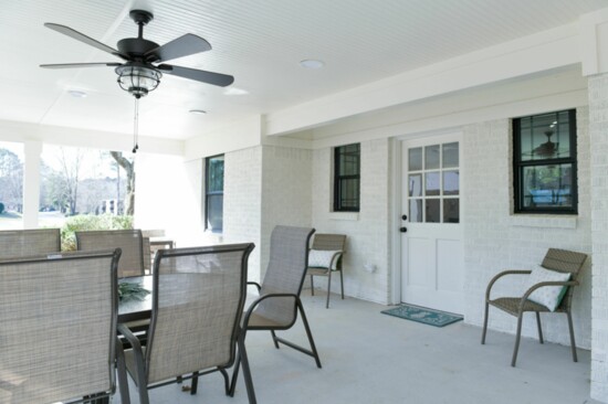 Residents have a covered back porch complete with furniture donated by Atlanta Home & Patio
