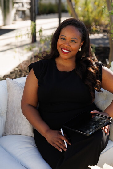 Serena Saints, the owner of Serenity Bloom, smiling for the camera.