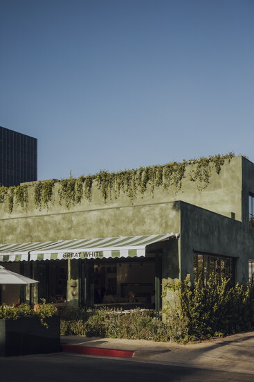 The restaurant's eye-catching green facade. Photo Credit: Brecht Van't Hof