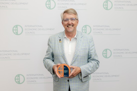 Roswell Inc. President & CEO Steve Stroud accepted the Excellence in Economic Development Award at the IEDC Annual Conference in Denver