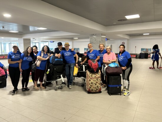 Eddie Estevez (right, with red bag), arrives in Cabo Verde in April with a crew from CVU. 