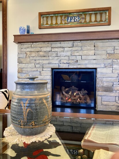 Elements of stone add a natural touch to Hildebrand's living area, like this gas fireplace.