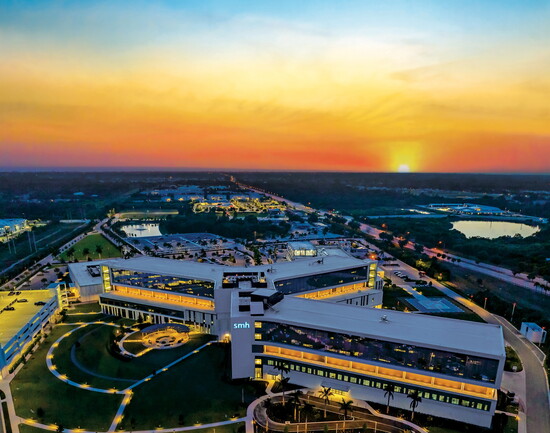 Aerial view of Sarasota Memorial Hospital - Venice at dusk.
