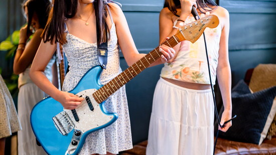 Nelly on guitar and Presley on vocals.