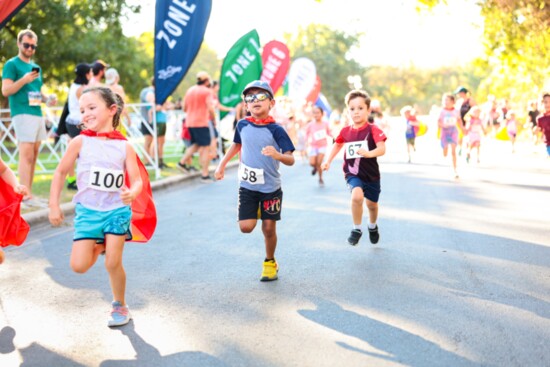 Participants race to the finish during the 2023 Zilker Relays.