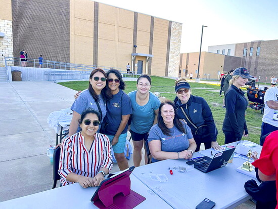 Argyle Band Boosters checking in runners at last year's Band on the run event.