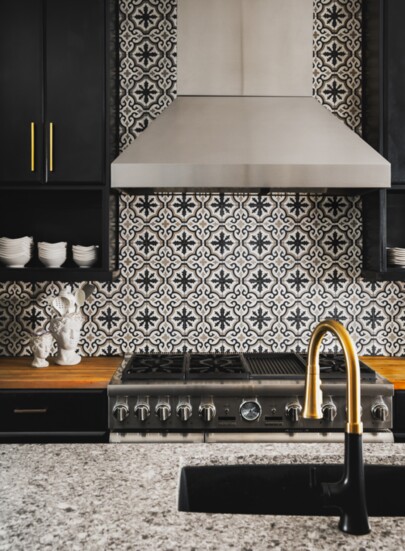A sleek tile backsplash compliments state-of-the-art appliances.