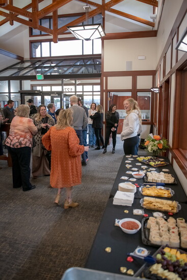 Adams Bank & Trust welcomes community members during a Windsor gathering, reflecting the bank’s commitment to connection, conversation, and local involvement.