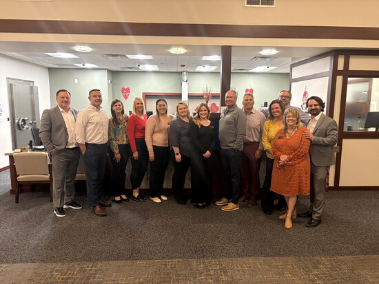 Adams Bank & Trust Windsor team gathers together, representing the people-first culture and collaborative spirit that guide the bank’s work in the community.