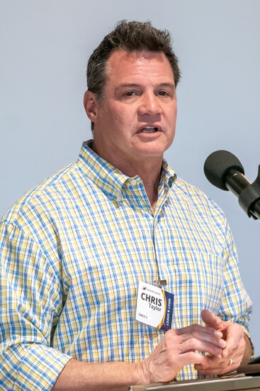 Forward Sumner Executive Director Chris Taylor addresses the 2026 annual meeting assembly.