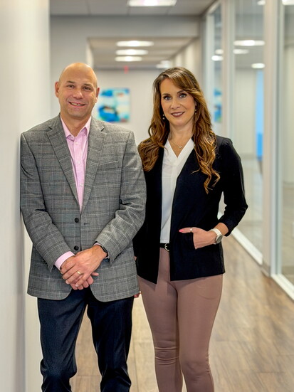 Dan Sutton with Kemba Credit Union Marketing Manager Julie Betz Eutsler.