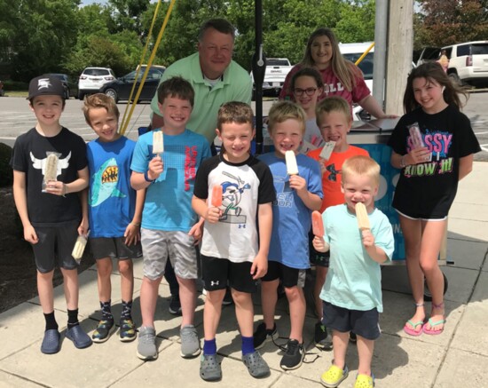 John Riley of Cullman Savings Bank has Frio’s popsicles for everyone.