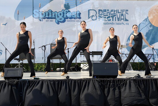 Dancers take the stage, one of many youth performance groups.