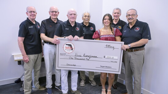 arget Masters members (L-R) Randy Mineo, Ray Leather, Paul Drimmer, Richie Fortino, Frank Henneberg and Lou Divito surround award winner Lexi Karajman.