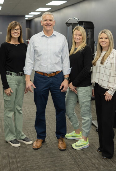 Left to right are Clinical Manager Kim Parker, PTA, CLT Clinical Manager; President Mike Tucker, PT, CSCS, Cert. DN; Office Manager Megan Roberts; and Regional 