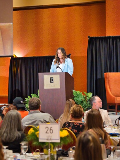 WomenGive recipient Kelli Howlett speaking at the 2024 WomenGive Luncheon