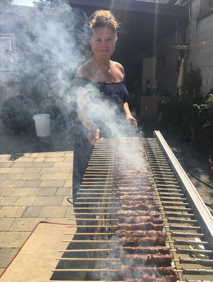 Filomena with the automatic arrosticini turner in her backyard