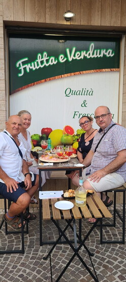 A place in town to have prosecco aperitivo while buying fruit and greens.